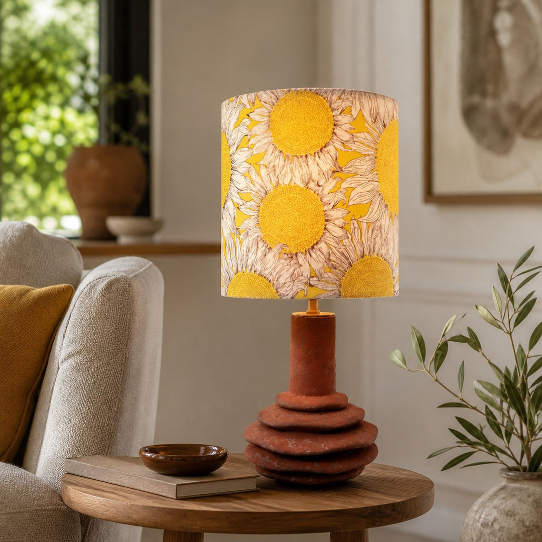 Sunflower ceramic table lamp on a side table