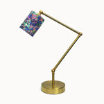 Load image into Gallery viewer, Adjustable brass-tone table lamp with purple botanical fabric shade