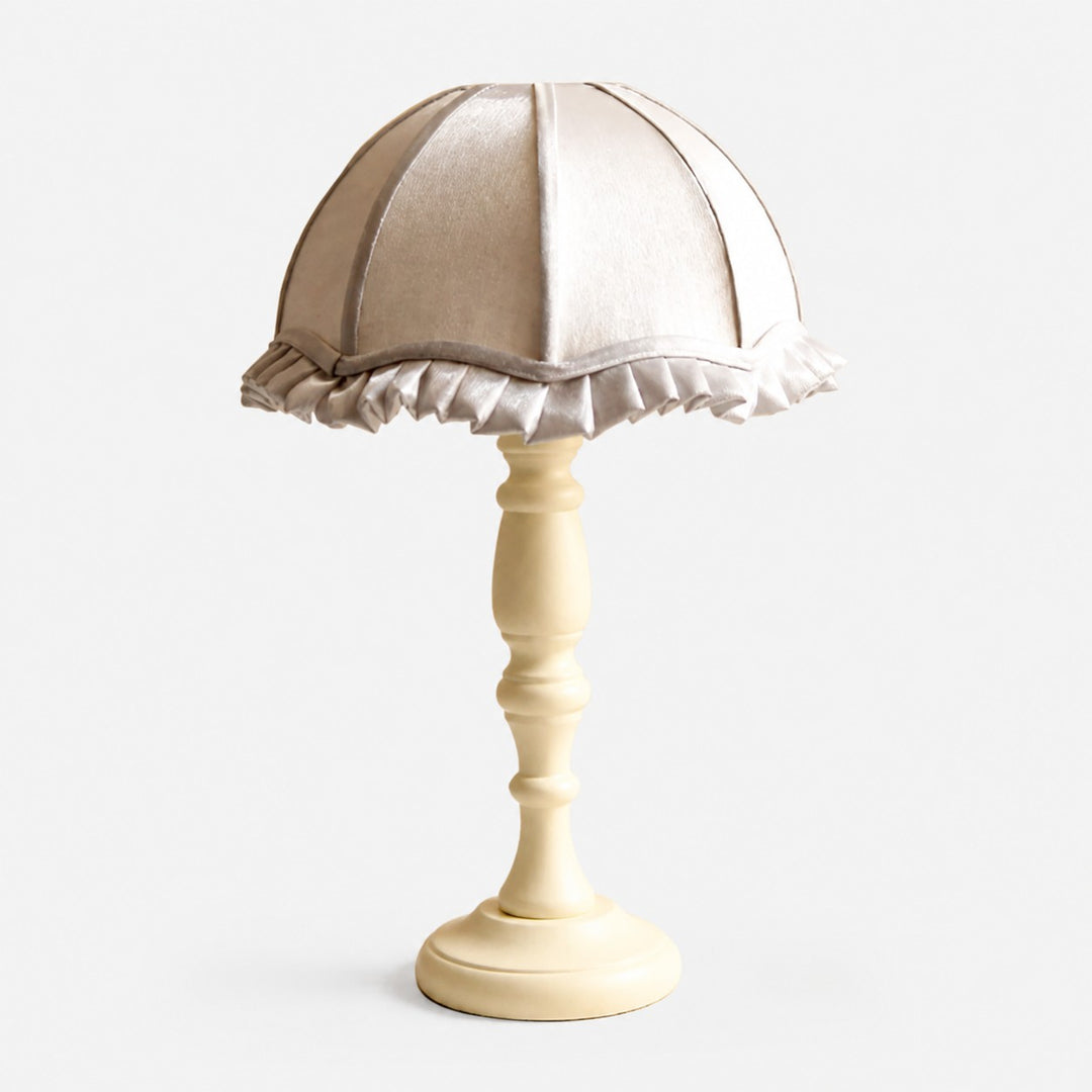 Silver fabric shade wood table lamp on white background