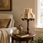 Bild in Gallery-Viewer laden, Vintage fabric table lamp on a round side table by a window