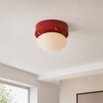 Load image into Gallery viewer, Red glass LED ceiling light installed in a compact neutral interior