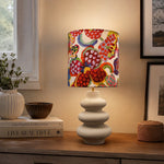 Bild in Gallery-Viewer laden, Floral fabric shade ceramic table lamp on a side table