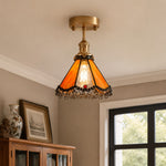Bild in Gallery-Viewer laden, Orange stained glass ceiling light above a cabinet corner
