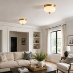 Load image into Gallery viewer, Pair of compact brass ceiling lights in a living room