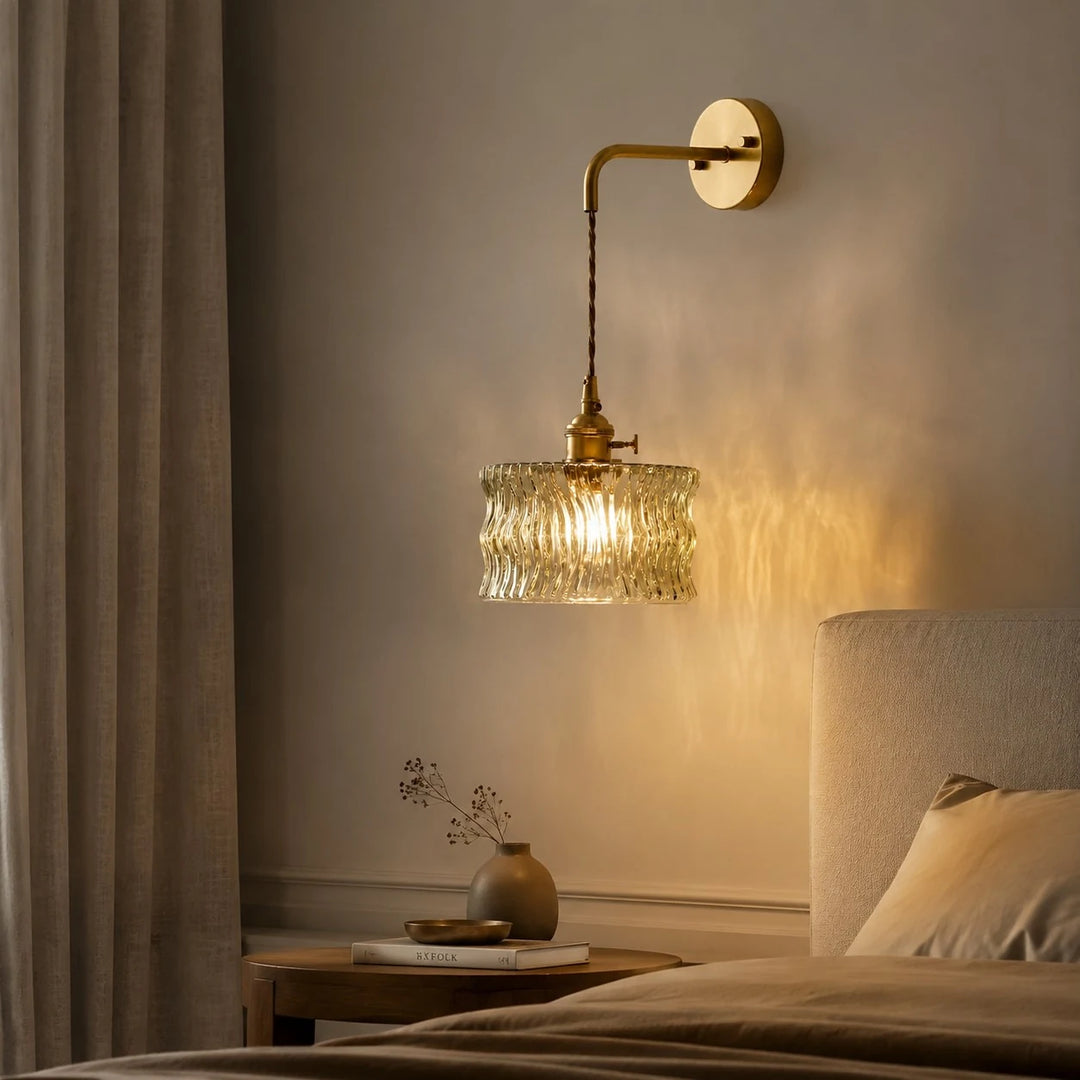 Chain-hung ripple glass wall light in a bedroom