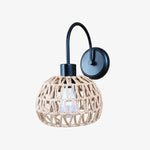 Bild in Gallery-Viewer laden, Shade A woven rattan wall sconce in matte black