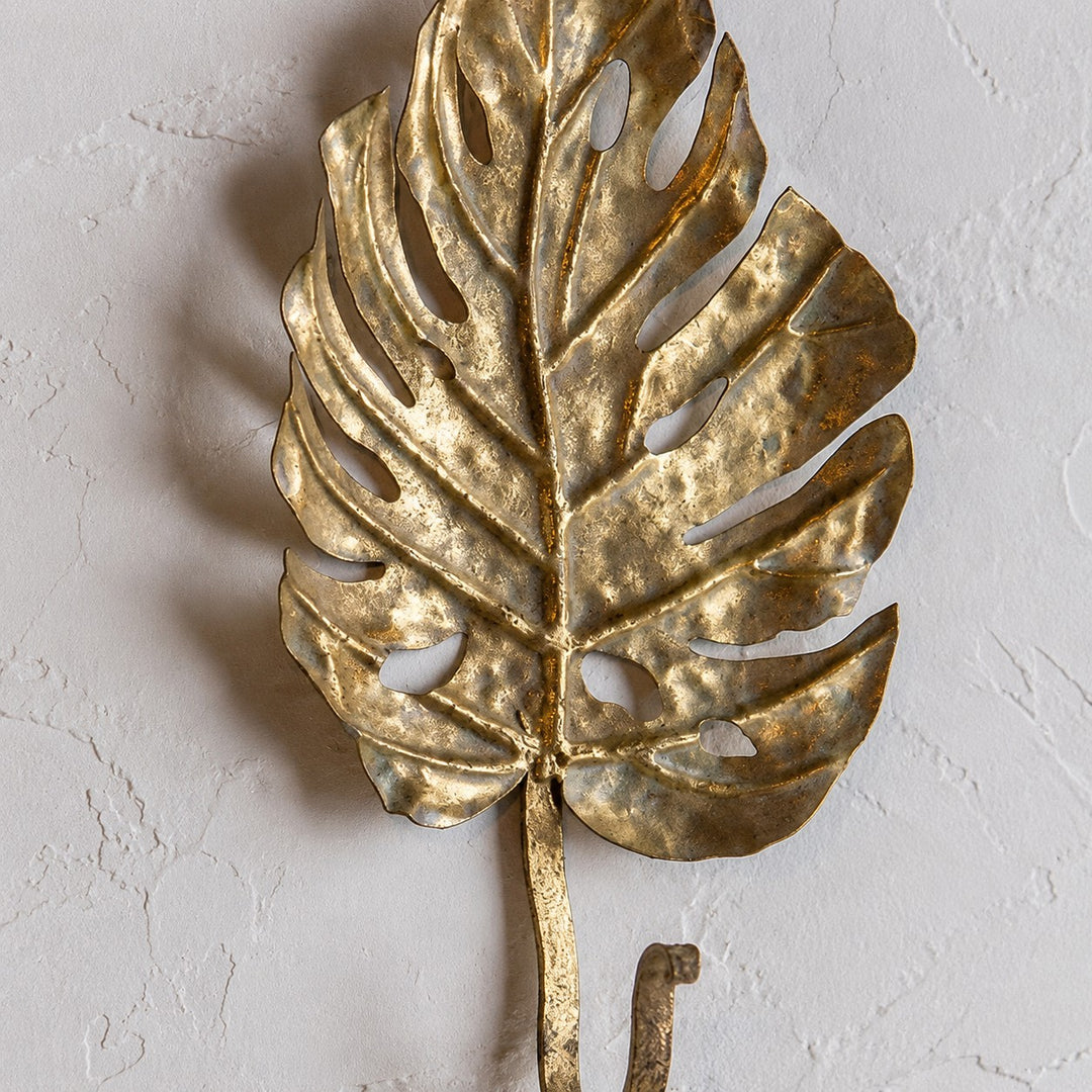 Raised botanical leaf form and wall-mounted hook