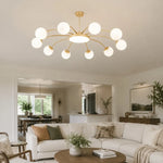 Load image into Gallery viewer, Gold ten-light chandelier in an open-plan room