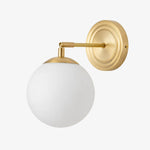 Load image into Gallery viewer, Gold wall lamp with a round milk glass shade