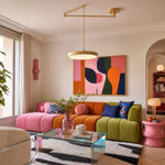 Load image into Gallery viewer, Gold movable pendant light in a colorful Bauhaus living room