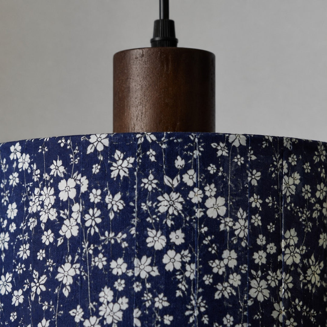 Blue floral fabric shade with wood-tone holder detail