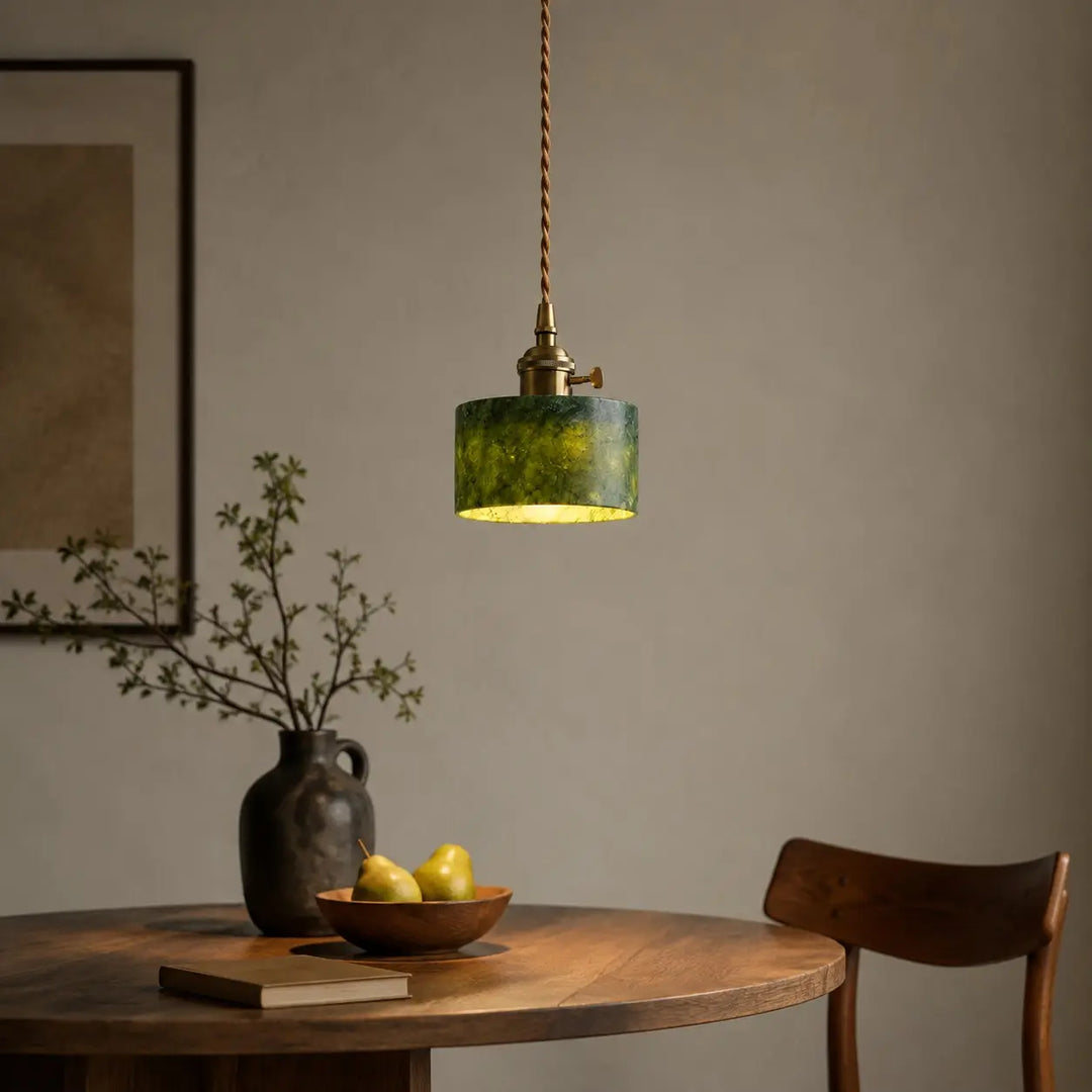 Jade pendant with switch above a dining table
