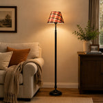 Charger l'image dans la visionneuse de galerie, Black iron floor lamp illuminating a calm bedroom corner