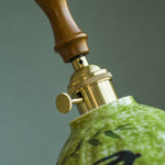 Load image into Gallery viewer, Botanical Glazed Ceramic Pendant Light with Brass-Tone Hardware - wood grip and brass-tone hardware detail