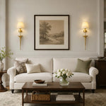 Load image into Gallery viewer, Brass fabric shade wall sconce installed in a living room