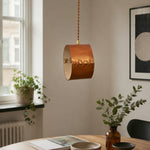 Bild in Gallery-Viewer laden, Hand-laced leather cylinder pendant light in an interior setting