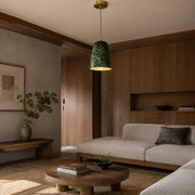 Pendant light in a warm bedside interior