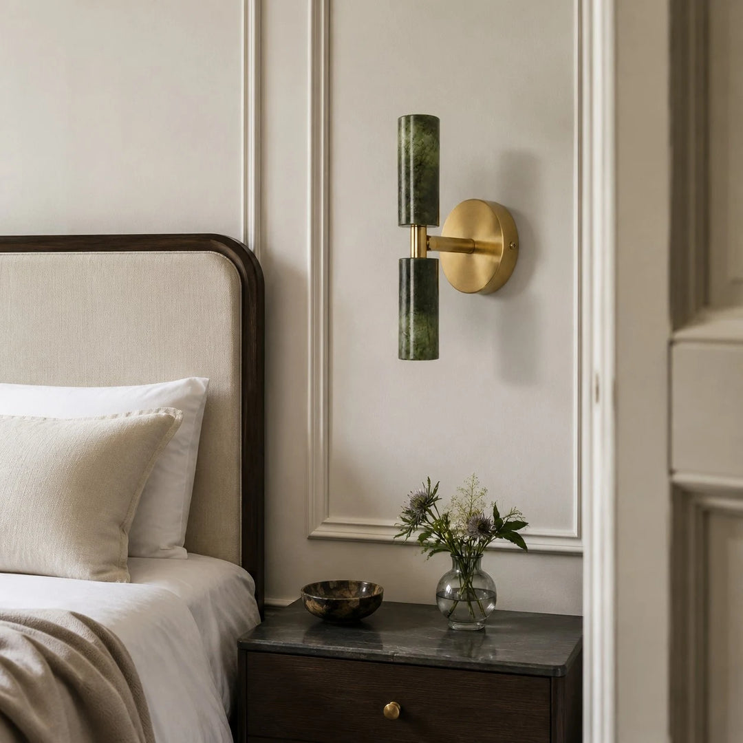 Natural green jade wall sconce installed beside a bed