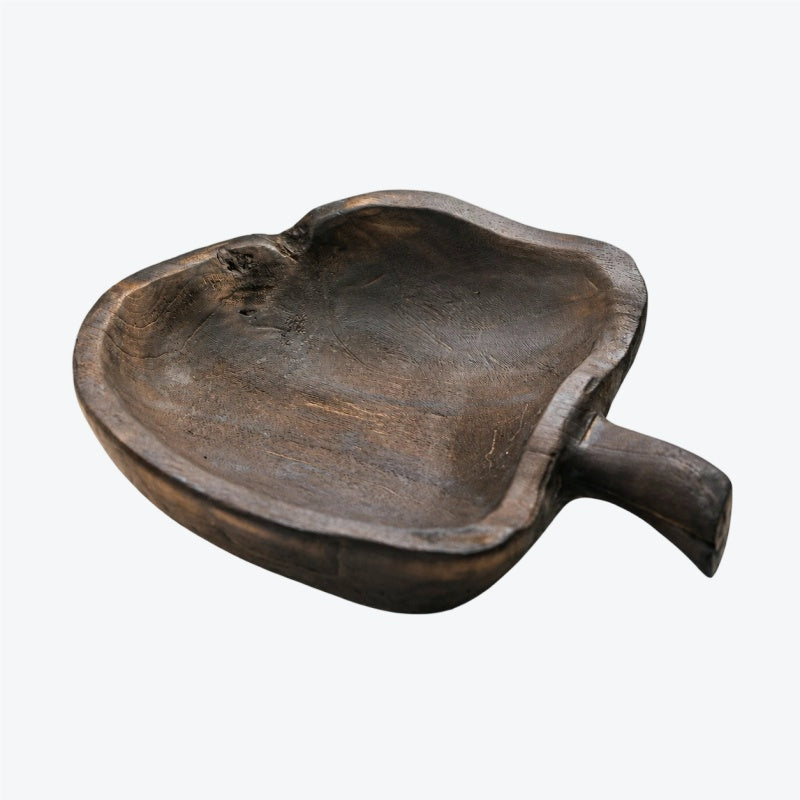 Apple-shaped wooden serving board on white background
