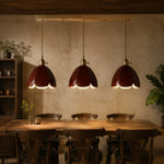 Load image into Gallery viewer, Three brown leather pendant lights in a restaurant setting