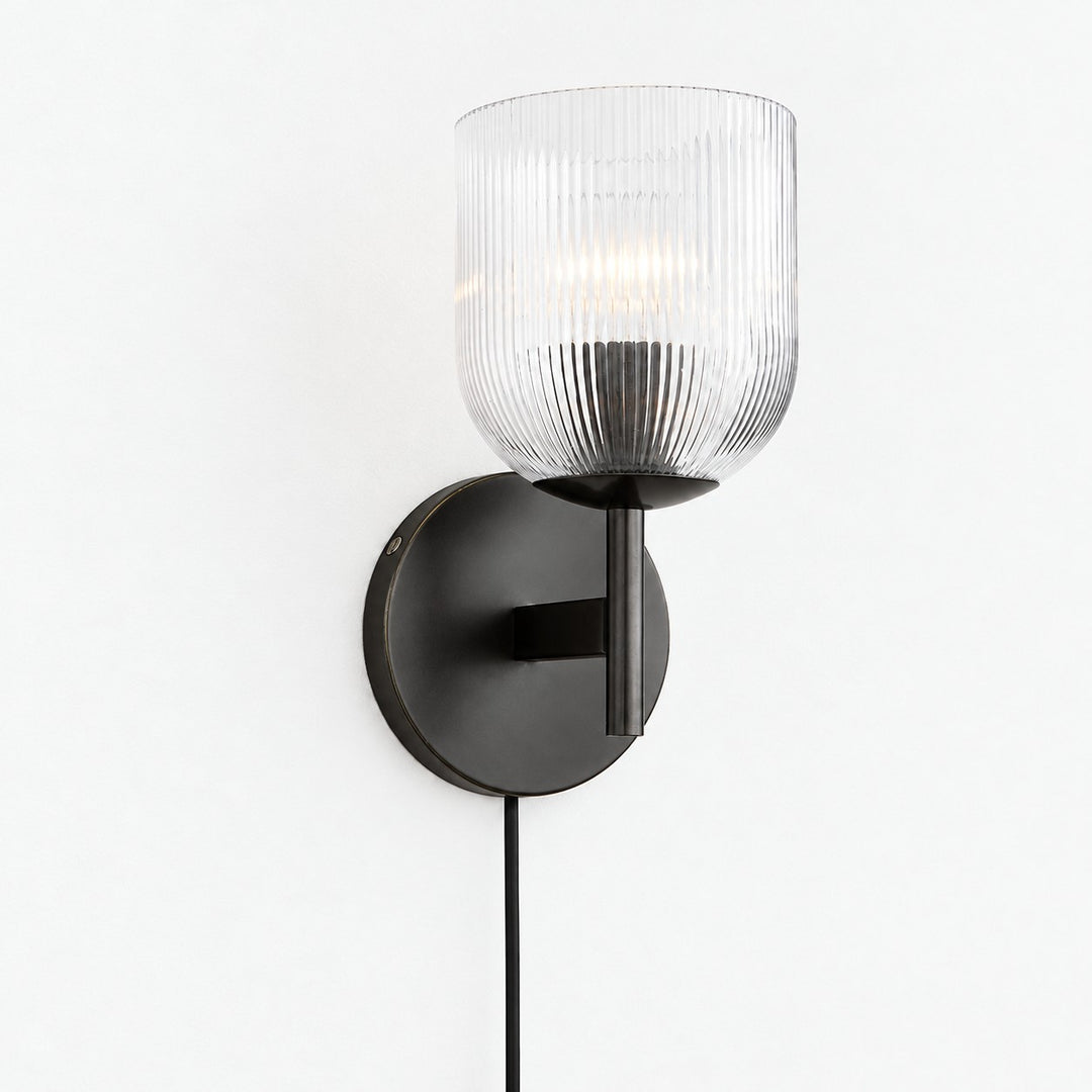 Black ribbed-glass wall sconce, one light