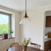 Clear ribbed pendant near a window corner