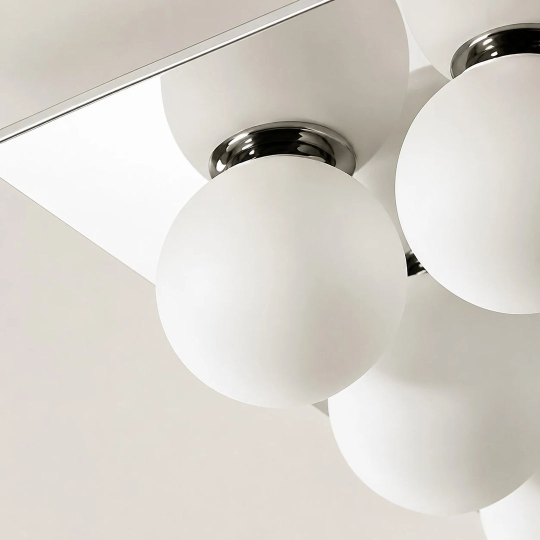 Detail image: close view of chrome fitting and glass diffuser.
