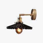 Bild in Gallery-Viewer laden, Black pleated ceramic wall sconce with metal arm and round backplate