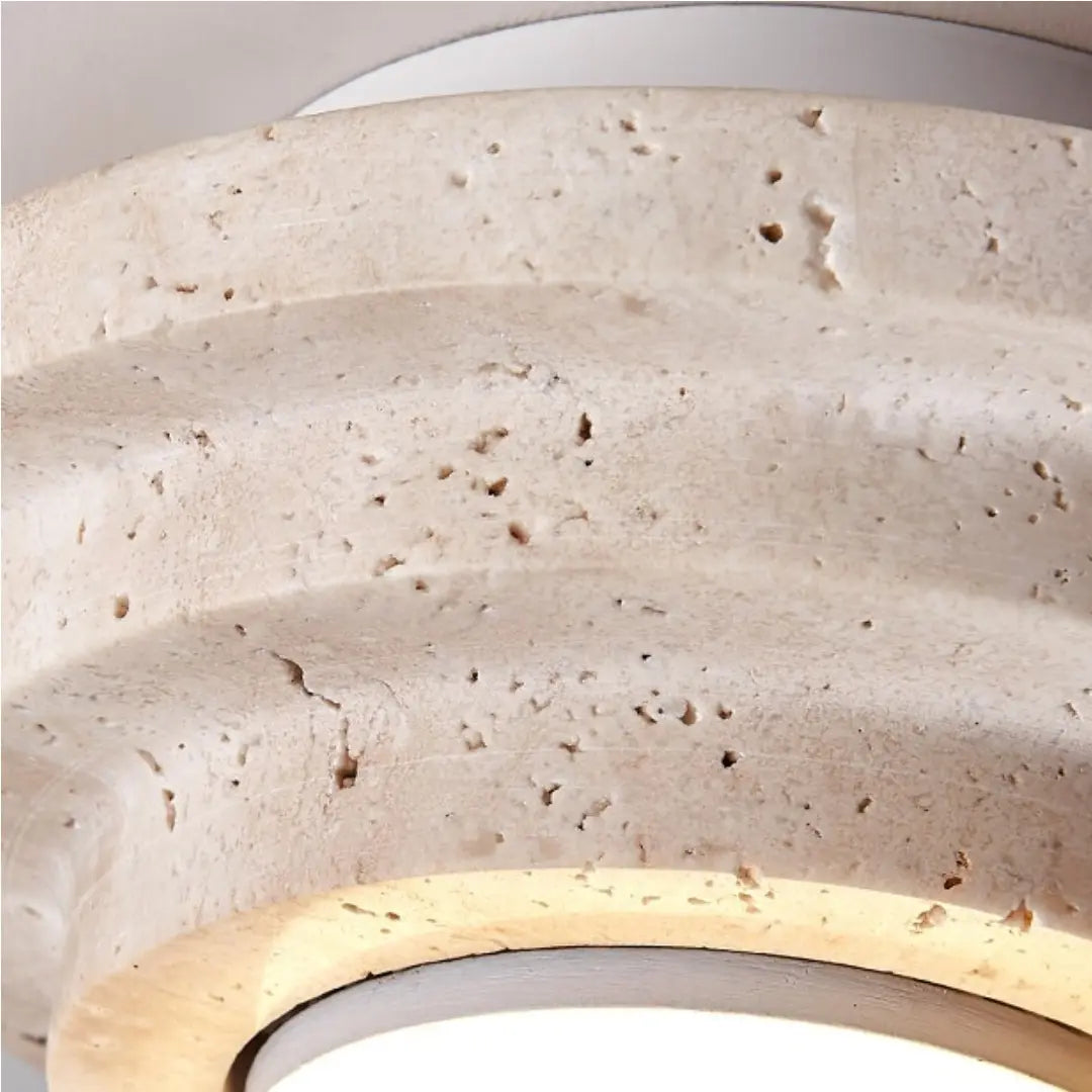 Close-up of the natural beige travertine texture and layered profile