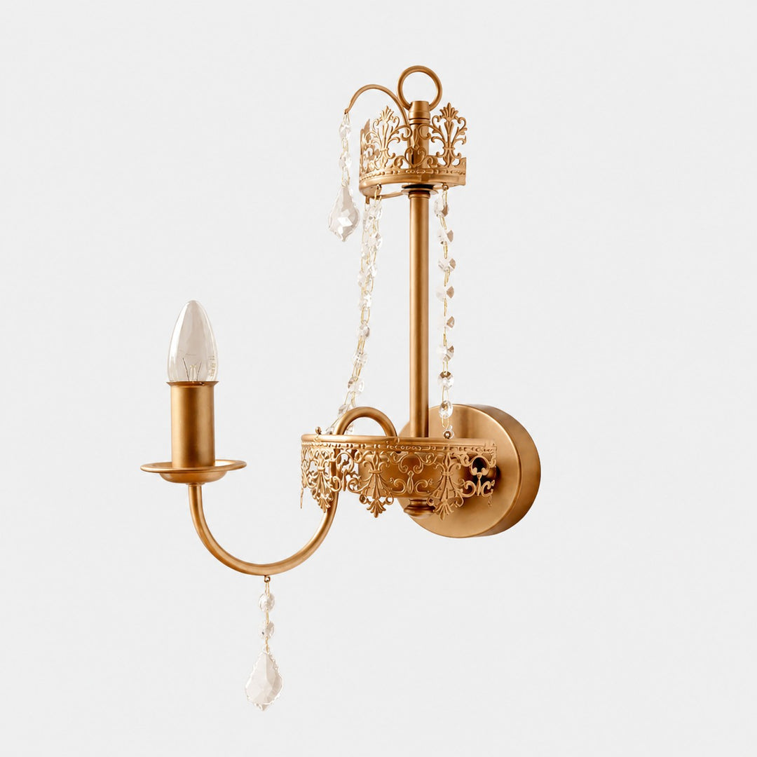 Antique brass French crystal candle wall sconce on a clean white background