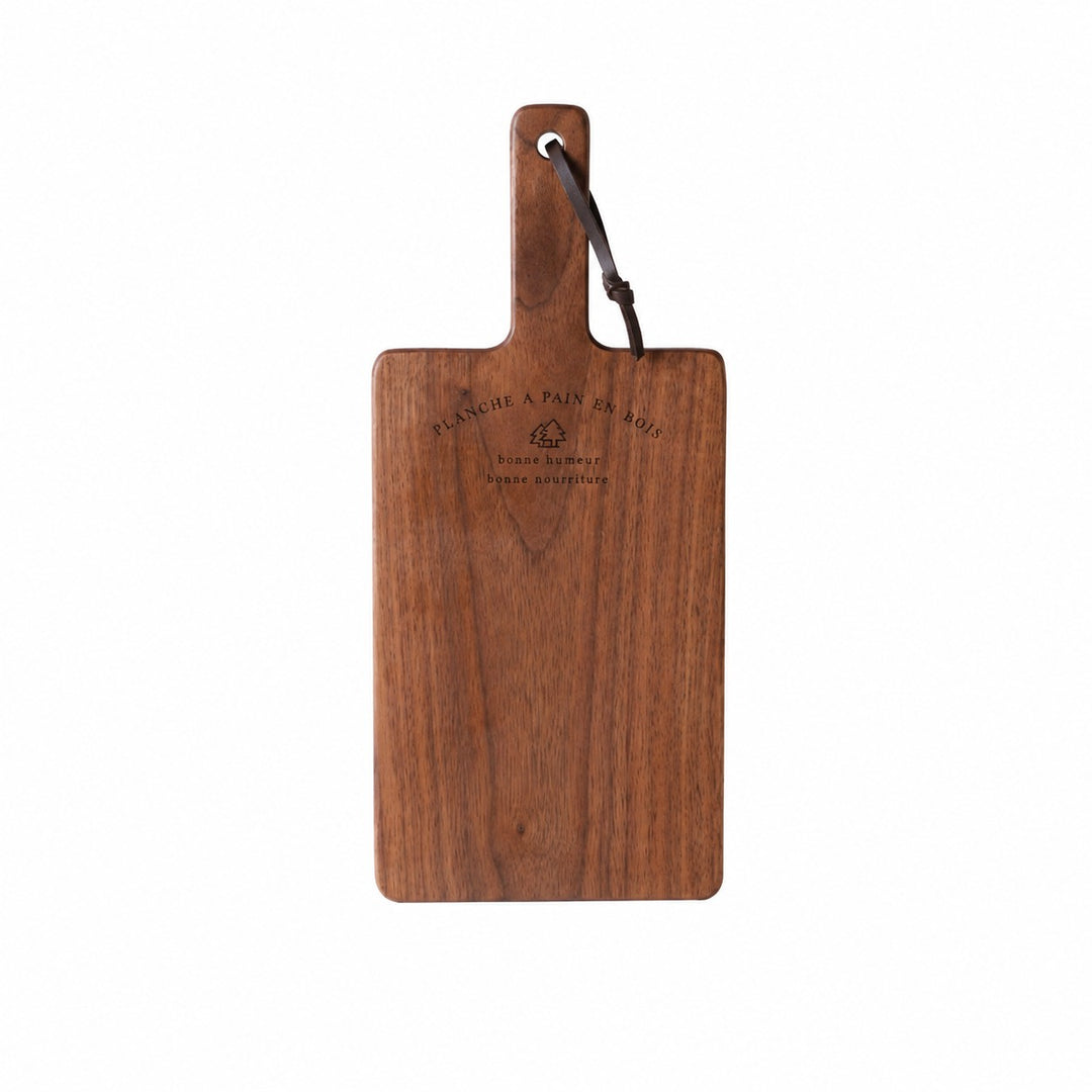 Medium black walnut cutting board on a white background