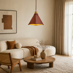 Load image into Gallery viewer, Leather pendant light installed above a warm living room seating area