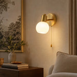 Load image into Gallery viewer, Pull-chain wall sconce styled in a bedroom