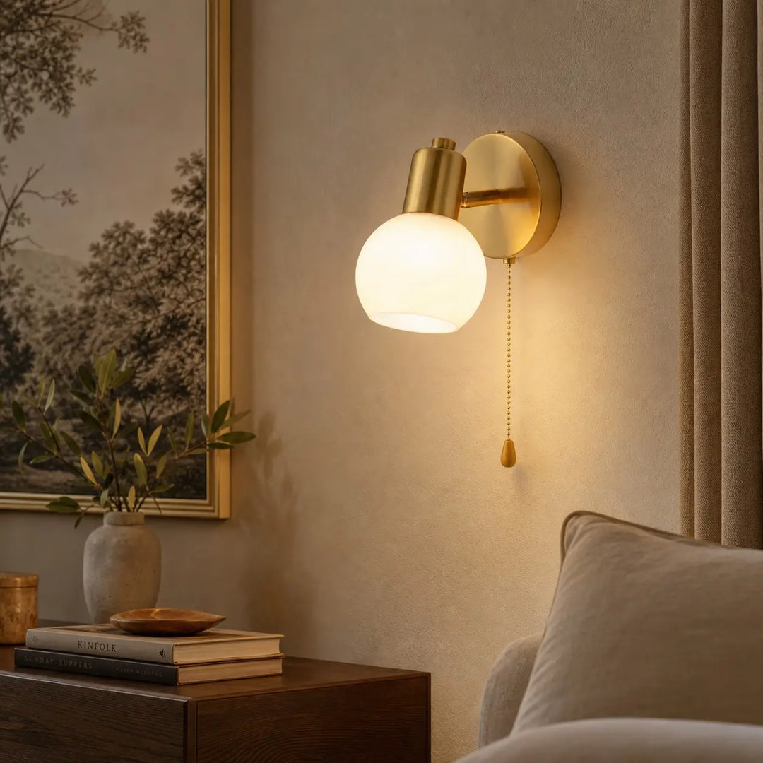 Pull-chain wall sconce styled in a bedroom