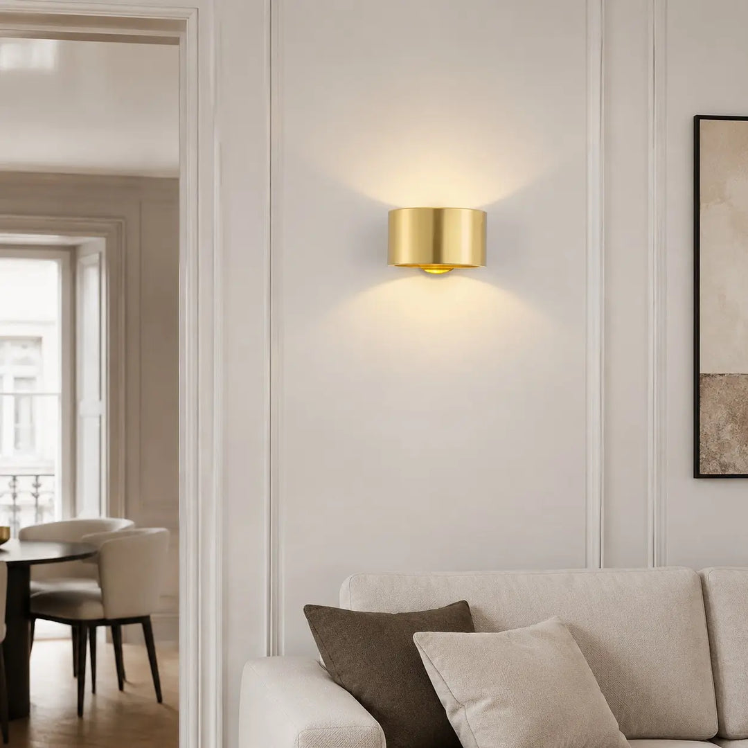 Gold brass wall light in a refined interior
