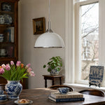 Load image into Gallery viewer, White ribbed pendant light in a bright dining room