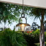 Load image into Gallery viewer, Clear black solar lantern hanging in a garden