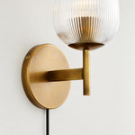 Bild in Gallery-Viewer laden, Close view of the ribbed glass shade, brass arm and plug-in cord