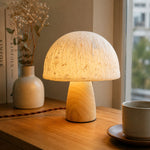 Cargar imagen en el visor de la Galería, Mushroom table lamp on a warm wooden surface near a window