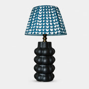 Sculptural ceramic table lamp with patterned fabric shade