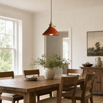 Load image into Gallery viewer, Glazed ceramic pendant installed above a light wood dining table