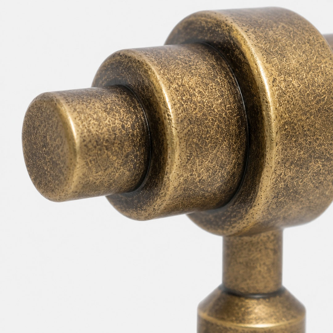 Rounded handle end and layered antique brass form
