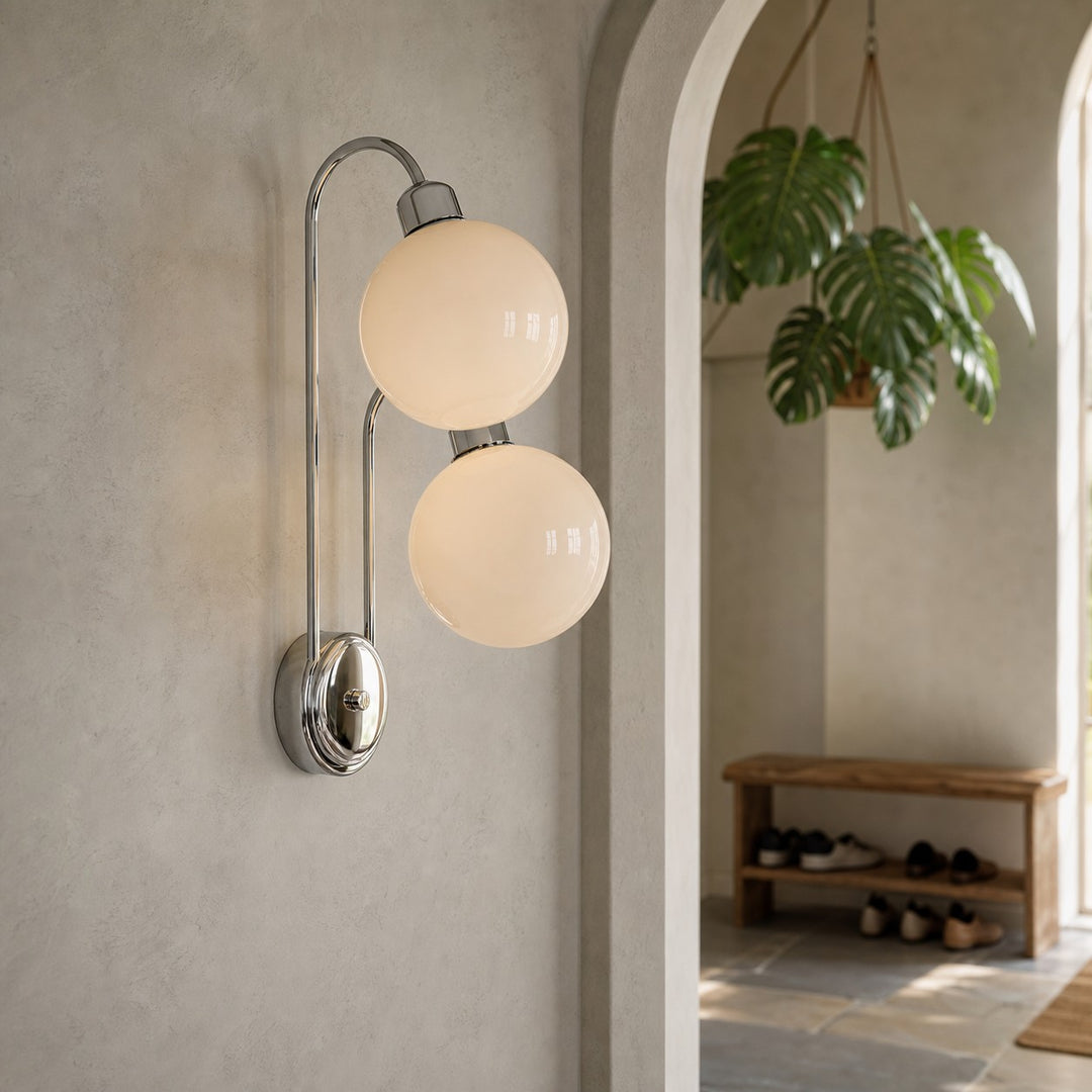 Milk coffee glass globe wall lamp above a vanity table