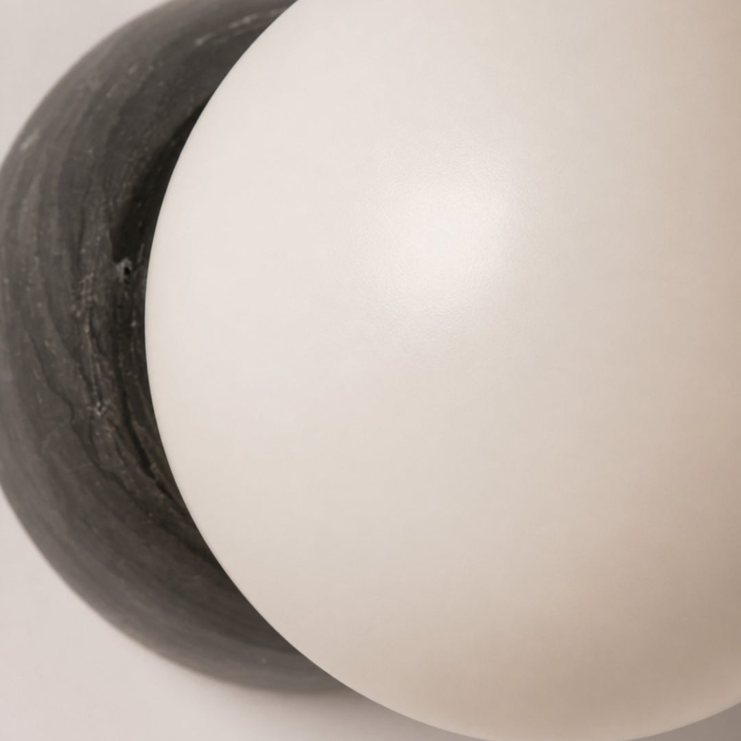 Close-up of the opal frosted glass globe and Black Marble backplate