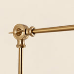Load image into Gallery viewer, Close view of the gold swing-arm joint