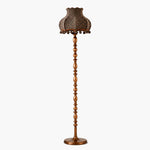 Bild in Gallery-Viewer laden, Brown striped floor lamp glowing between a sofa and wooden chest