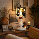 Bild in Gallery-Viewer laden, Smoke purple cat stained glass lamp glowing on a vintage console table