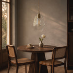 Cargar imagen en el visor de la Galería, Clear faceted glass pendant light over a small dining table