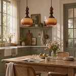 Charger l'image dans la visionneuse de galerie, Brown glass pendants over a kitchen dining table