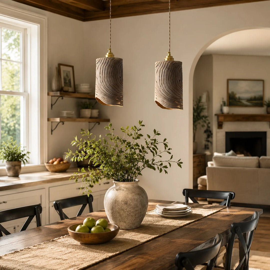 Two wooden pendant lights over dining table